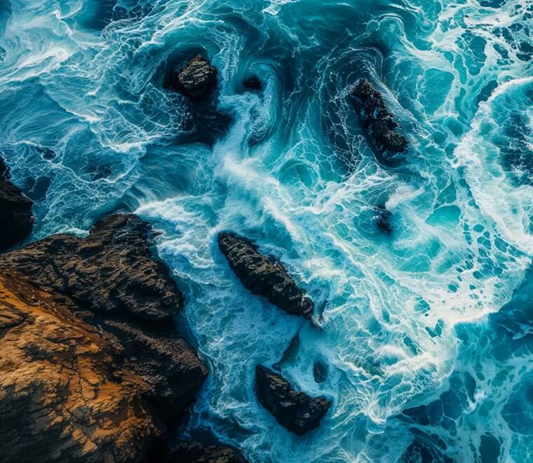 Waves hitting rocky shoreline